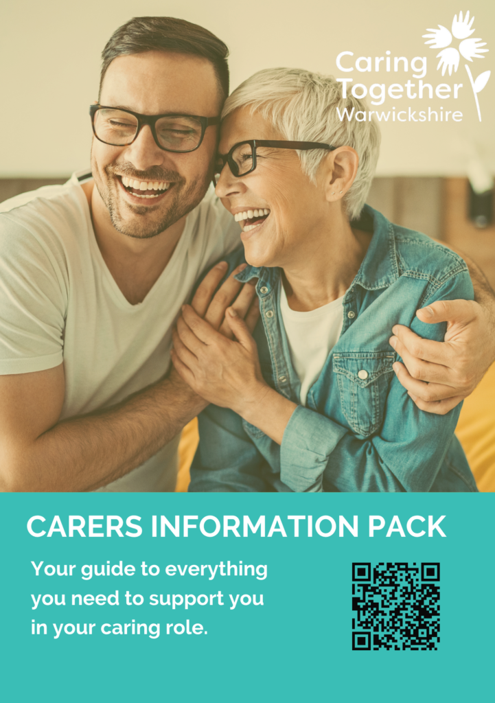 Carers Information Pack Cover Page. A man and woman hugging each other.
